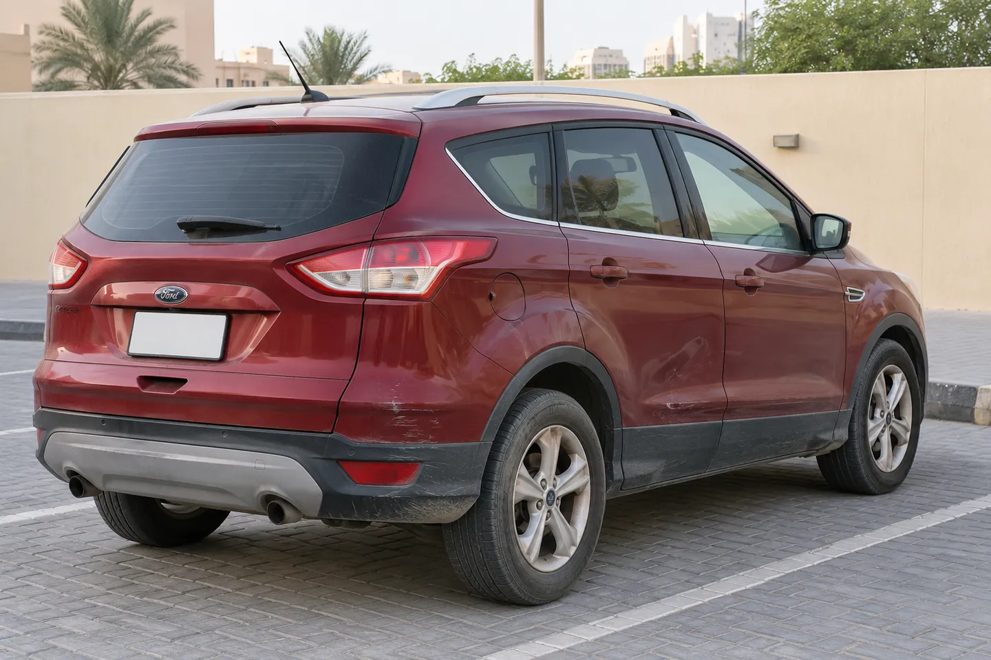Used older Ford-style SUV with modest rear bumper and door wear
